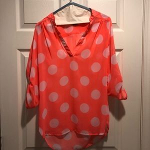 Bright orange polka dot top